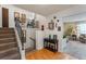 Bright entryway with staircase, console table, and view into living room at 602 Iris St, Altamonte Springs, FL 32714