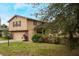 House exterior showcasing landscaping and a two-car garage at 602 Iris St, Altamonte Springs, FL 32714