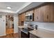 Kitchen with stainless steel appliances and wood cabinets at 602 Iris St, Altamonte Springs, FL 32714