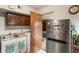 Small laundry room with a sink, cabinets, and a view into another room at 602 Iris St, Altamonte Springs, FL 32714