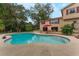 Spacious kidney shaped pool with surrounding patio at 602 Iris St, Altamonte Springs, FL 32714