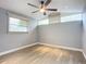 Spacious bedroom with wood-look floors and window blinds at 608 Powers Ave, Port Orange, FL 32127