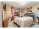 Cozy bedroom with a double bed and window at 628 Twin Oaks Cir, Daytona Beach, FL 32117