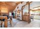 Dining area adjacent to living room with wood accents and kitchen access at 628 Twin Oaks Cir, Daytona Beach, FL 32117