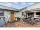 Brick paved patio with outdoor seating and a dining table at 628 Twin Oaks Cir, Daytona Beach, FL 32117