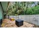 Private backyard patio with seating and wood fence at 717 Glasgow Ct, Winter Springs, FL 32708