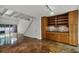 Modern kitchen features stained concrete floors and wooden cabinetry at 717 Glasgow Ct, Winter Springs, FL 32708