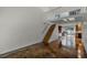 Open living room with loft, stained concrete floors, and wood staircase at 717 Glasgow Ct, Winter Springs, FL 32708