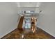 Open living room with loft, stained concrete floors, and wood staircase at 717 Glasgow Ct, Winter Springs, FL 32708