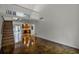 Open living room with loft, stained concrete floors, and wood staircase at 717 Glasgow Ct, Winter Springs, FL 32708