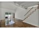 Open living room with loft, stained concrete floors, and wood staircase at 717 Glasgow Ct, Winter Springs, FL 32708