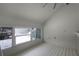 Spacious loft bedroom with large windows and wood floors at 717 Glasgow Ct, Winter Springs, FL 32708