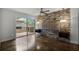 Main bedroom with stone wall, ceiling fan and sliding doors at 717 Glasgow Ct, Winter Springs, FL 32708