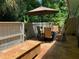 Relaxing patio with seating area, umbrella, and stone flooring at 717 Glasgow Ct, Winter Springs, FL 32708