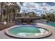 Community pool with surrounding patio and tables at 717 Glasgow Ct, Winter Springs, FL 32708