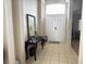 Bright entryway with tile flooring and a console table at 800 Woodlark Dr, Davenport, FL 33897