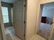 Hallway with doors leading to bathroom and bedroom at 800 Woodlark Dr, Davenport, FL 33897