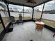 Screened porch with table and chairs at 800 Woodlark Dr, Davenport, FL 33897