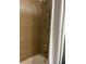 Shower stall with tan tile and shower curtain at 8421 S Orange Blossom Trl # 321, Orlando, FL 32809