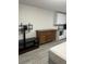 Living room featuring a media console and a bed at 8421 S Orange Blossom Trl # 321, Orlando, FL 32809