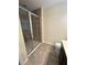 Bathroom with shower and dark vanity at 8692 Wellington Blue Ln, Windermere, FL 34786