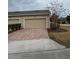 Attached garage with brick driveway at 8692 Wellington Blue Ln, Windermere, FL 34786