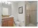 Bathroom with shower, granite countertop, and toilet at 8925 Candy Palm Rd, Kissimmee, FL 34747