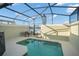 Private screened pool and patio furniture, lake view at 8925 Candy Palm Rd, Kissimmee, FL 34747