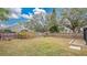 Backyard with a wooden fence and various plants at 905 Hatteras Ave, Minneola, FL 34715