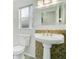Bathroom with pedestal sink, decorative mosaic tile, and contemporary fixtures at 905 Hatteras Ave, Minneola, FL 34715