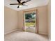 Well-lit bedroom with carpeted floor and a window at 905 Hatteras Ave, Minneola, FL 34715