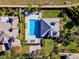 Aerial view showcasing a private pool, outdoor seating, meticulous landscaping, and a well-maintained roof at 10812 Woodchase Cir, Orlando, FL 32836
