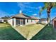 Spacious backyard with green lawn, partially covered patio, and plenty of room to relax at 10812 Woodchase Cir, Orlando, FL 32836