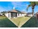 House backyard with grassy lawn and screened porch at 10812 Woodchase Cir, Orlando, FL 32836