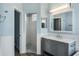 Modern bathroom with walk-in shower, sleek vanity, and neutral tones, offering a clean and contemporary design at 10812 Woodchase Cir, Orlando, FL 32836