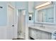 Bright bathroom with a walk-in shower, modern vanity, and neutral color palette at 10812 Woodchase Cir, Orlando, FL 32836