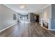 Bright and open living space with hardwood floors, a fireplace, and an airy design at 10812 Woodchase Cir, Orlando, FL 32836