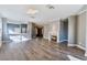 Spacious living room with hardwood floors, a fireplace, and an open layout perfect for modern living at 10812 Woodchase Cir, Orlando, FL 32836