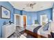 Spacious main bedroom with a modern dresser, walk in closet, and ensuite bathroom at 10812 Woodchase Cir, Orlando, FL 32836