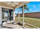 Covered screened patio with access to the backyard at 10812 Woodchase Cir, Orlando, FL 32836