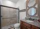 Bathroom with shower, toilet and granite vanity at 10875 Savona Way, Orlando, FL 32827