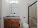 Bathroom with shower, toilet and granite vanity at 10875 Savona Way, Orlando, FL 32827