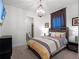 Cozy bedroom with ensuite bathroom and window at 10875 Savona Way, Orlando, FL 32827