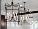 Elegant light fixtures illuminating kitchen island at 10875 Savona Way, Orlando, FL 32827