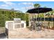 Built-in stainless steel grill and outdoor kitchen at 10875 Savona Way, Orlando, FL 32827