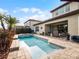 Resort-style pool with spa and spacious patio at 10875 Savona Way, Orlando, FL 32827