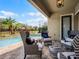 Relaxing poolside patio with stylish seating and a view at 10875 Savona Way, Orlando, FL 32827