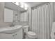 Bathroom with a white vanity, toilet, and shower at 1140 S Orlando Ave # K15, Maitland, FL 32751