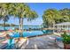 Inviting community pool with lake views and lounge chairs at 1140 S Orlando Ave # K15, Maitland, FL 32751