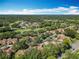 Aerial view of community with houses and green spaces at 123 Golf Club Dr, Longwood, FL 32779